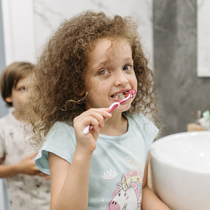 Heninger Dental: Dr Cam Heninger in Orem child toothbrush 2023 700